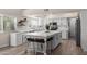 Beautiful white kitchen featuring an island, bright windows and modern appliances at 1501 N Lesueur --, Mesa, AZ 85203