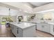 Charming kitchen boasts natural light, an island, stainless steel appliances and bright countertops at 1501 N Lesueur --, Mesa, AZ 85203