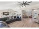 Spacious living room with hardwood floors, vaulted ceilings, and neutral walls provides an airy feel at 1501 N Lesueur --, Mesa, AZ 85203