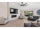 Cozy living room with a decorative fireplace and plenty of natural light at 1501 N Lesueur --, Mesa, AZ 85203