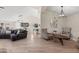 Open-concept living room featuring wood floors and contemporary decor at 1501 N Lesueur --, Mesa, AZ 85203