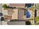 Aerial view of the property featuring a sparkling pool, desert landscaping, and tile roof at 15853 S 17Th Dr, Phoenix, AZ 85045