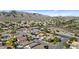 A stunning aerial view of a community with mountain views, well-maintained streets, and desert landscaping at 15853 S 17Th Dr, Phoenix, AZ 85045