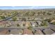 An aerial view of a well-planned community with lush landscaping, wide streets and mountain views in the distance at 15853 S 17Th Dr, Phoenix, AZ 85045