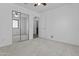 A bright bedroom features neutral colored walls, carpet flooring, and a mirrored closet at 15853 S 17Th Dr, Phoenix, AZ 85045