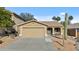 Charming single-story home featuring a two-car garage and low-maintenance desert landscaping at 15853 S 17Th Dr, Phoenix, AZ 85045