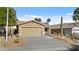 Charming single-story home featuring a two-car garage and low-maintenance desert landscaping at 15853 S 17Th Dr, Phoenix, AZ 85045