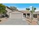 Charming single-story home featuring a two-car garage and desert landscaping at 15853 S 17Th Dr, Phoenix, AZ 85045