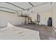 Spacious, clean garage featuring a storage system, water heater, and ample room for vehicles and storage at 15853 S 17Th Dr, Phoenix, AZ 85045