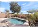 Backyard features a gorgeous pool surrounded by desert landscaping, mature trees, and a privacy fence at 15853 S 17Th Dr, Phoenix, AZ 85045