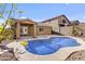 A beautiful backyard with a sparkling pool and lush desert landscaping at 15853 S 17Th Dr, Phoenix, AZ 85045