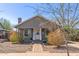 Charming single-story home featuring a stone pathway, neutral paint, and a welcoming front porch at 1645 W Willetta St, Phoenix, AZ 85007