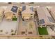 Aerial view of the backyard featuring a fire pit area and garden boxes, complemented by solar panels on the house at 17176 W Molly Ln, Surprise, AZ 85387