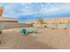 Large backyard features a fire pit, gravel and room to run at 17176 W Molly Ln, Surprise, AZ 85387