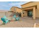 Backyard with fire pit and adirondack chairs at 17176 W Molly Ln, Surprise, AZ 85387
