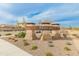 Elegant community entrance sign displaying the neighborhood name 'Mirano' with manicured landscaping at 17176 W Molly Ln, Surprise, AZ 85387