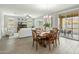 Dining room flows into the living area and offers access to the outdoor patio through sliding glass doors at 17176 W Molly Ln, Surprise, AZ 85387