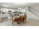 Bright dining area with chandelier connects the modern kitchen to the rest of the home at 17176 W Molly Ln, Surprise, AZ 85387