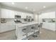 Beautiful kitchen with a large island with seating, stainless steel appliances, and ample cabinet space at 17176 W Molly Ln, Surprise, AZ 85387