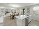 Modern island kitchen sink area offers views to the dining and living areas at 17176 W Molly Ln, Surprise, AZ 85387