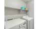 Convenient laundry room with modern washer and dryer at 17176 W Molly Ln, Surprise, AZ 85387