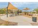 Community park featuring playground equipment and shaded seating areas for residents to enjoy outdoor activities at 17176 W Molly Ln, Surprise, AZ 85387