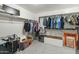 Spacious walk-in closet featuring built-in shelving and hanging rods at 17176 W Molly Ln, Surprise, AZ 85387