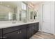 Stylish bathroom features double sinks, sleek vanities, and a glass-enclosed shower at 1756 E Bridgeport Pkwy, Gilbert, AZ 85295