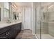 Stylish bathroom features double sinks, sleek vanities, and a glass-enclosed shower at 1756 E Bridgeport Pkwy, Gilbert, AZ 85295