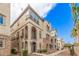 Attractive multi-level townhomes boasting stucco exteriors, arched entryways and private balconies at 1756 E Bridgeport Pkwy, Gilbert, AZ 85295