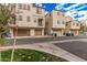 Street showcasing townhomes with garages and landscaping at 1756 E Bridgeport Pkwy, Gilbert, AZ 85295
