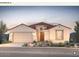 Charming single-story home featuring a two-car garage and beautifully landscaped front yard at 17627 W Palo Verde Dr, Litchfield Park, AZ 85340