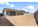 Wide backyard featuring a covered patio and block wall at 17637 W Rancho Dr, Litchfield Park, AZ 85340