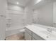 Bathroom featuring a shower-tub combo, white vanity, and a large mirror for an airy feel at 17637 W Rancho Dr, Litchfield Park, AZ 85340