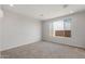 Bright bedroom featuring neutral carpet, ample natural light, and modern recessed lighting at 17637 W Rancho Dr, Litchfield Park, AZ 85340