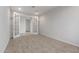 Versatile bonus room with double doors, neutral carpet, and ample natural light at 17637 W Rancho Dr, Litchfield Park, AZ 85340