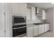 Stainless appliances featuring oven, microwave, cooktop and granite countertops at 17637 W Rancho Dr, Litchfield Park, AZ 85340