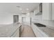 Island kitchen with stainless steel appliances and granite countertops at 17637 W Rancho Dr, Litchfield Park, AZ 85340