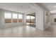 Living room with tile flooring and sliding glass doors to the patio at 17637 W Rancho Dr, Litchfield Park, AZ 85340