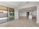 Living room opens to the kitchen with sliding glass doors to the patio at 17637 W Rancho Dr, Litchfield Park, AZ 85340