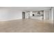 An open concept living room and kitchen featuring tile floors at 17637 W Rancho Dr, Litchfield Park, AZ 85340