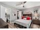 Bedroom featuring a full bed and open access to the closet and bathroom at 1951 N 64Th St # 69, Mesa, AZ 85205