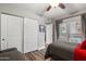 Bedroom with hardwood floors, closet, and a view to a balcony at 1951 N 64Th St # 69, Mesa, AZ 85205