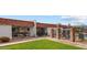 Exterior view of a home with a tile roof, patio, and fenced pool at 1951 N 64Th St # 69, Mesa, AZ 85205
