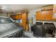 Attached garage with ample storage cabinetry, newer model car, and laundry machines at 1951 N 64Th St # 69, Mesa, AZ 85205