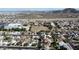 A scenic aerial view of a neighborhood with open field and mountains in the background, showcasing an inviting community at 19601 N 14Th St, Phoenix, AZ 85024