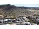 A picturesque aerial view of a Gathering neighborhood with mountains in the background at 19601 N 14Th St, Phoenix, AZ 85024