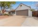 This home has a two-car garage, desert landscaping, and a well-maintained exterior at 19601 N 14Th St, Phoenix, AZ 85024