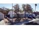 Charming home exterior featuring mature trees, an RV parked along the side and a welcoming front yard at 19601 N 14Th St, Phoenix, AZ 85024