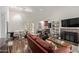 Open-concept living room with a fireplace and dining area, complete with lots of natural light at 19601 N 14Th St, Phoenix, AZ 85024